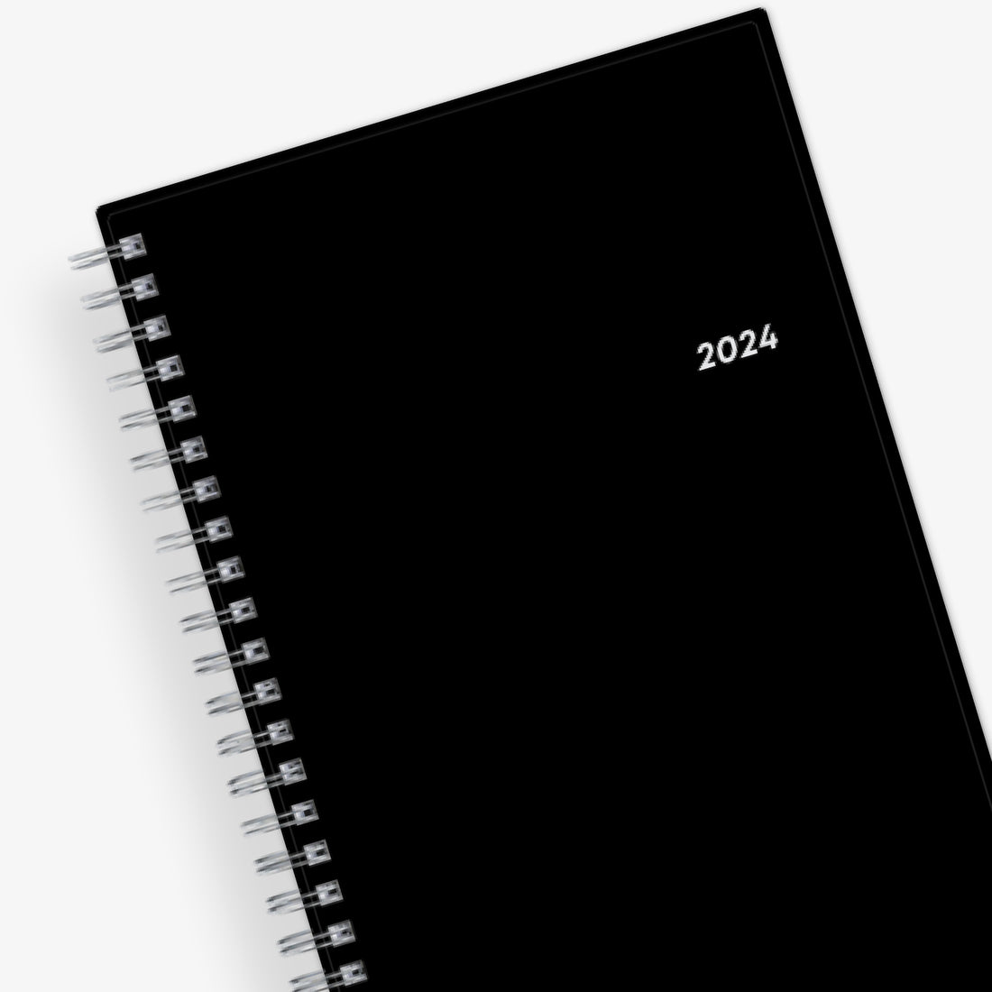 Bilingual January 2024 - December 2024 weekly monthly planner featuring a black front cover design and silver twin wire-o binding. calendario de planificacion