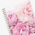 2024 Rachel Parcell daily planner featuring a beautiful rose pattern hardcover on gold twin wire-o binding in a 7x9 size.