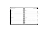 Aligned 2024 planner notes features a weekly spread featuring clean, lined writing space and reference calendars for the year to stay organized throughout the year.