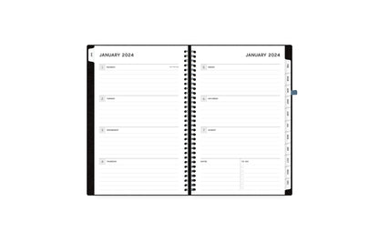 Aligned 2024 planner notes features a weekly spread featuring clean, lined writing space and reference calendars for the year to stay organized throughout the year.