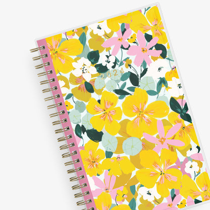 2024 planner weekly monthly featuring gold wire-o and yellow pink flowers