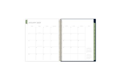 The 2024 Kelly Ventura special collection features a monthly spread with boxed days, clean white writing space, rfeference calendars, and soft olive green monthly tabs in a 8.5x11 planner size.