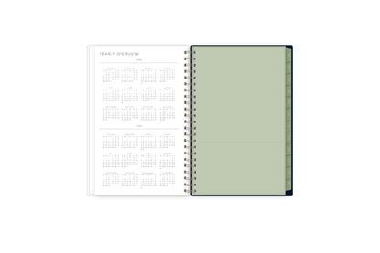 2024-2024 yearly overview spread featuring a view of all the months on one page, and a paper pocket for ultimate storage and organization!