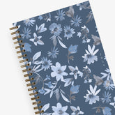 024 blue sky sustainability weekly monthly planner featuring white and blue floral patterns on a dark blue background 5x8 gold wire-o