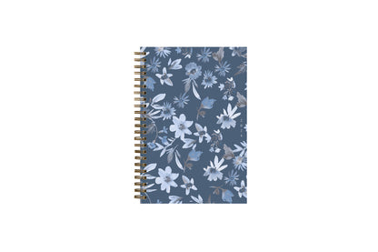2024 blue sky sustainability weekly monthly planner featuring white and blue floral patterns on a dark blue background 5x8 gold wire-o