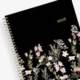 January 2026 - December 2026 monthly planner from Blue Sky features beautiful floral cover design with black background and gold binding