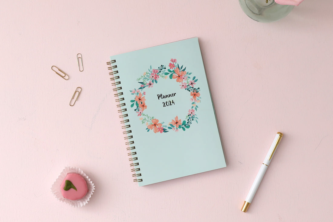 January 2024 to December 2024 weekly monthly planner in 5x8 size from day designer for blue sky with mint background and floral pattern, and gold twin wire-o binding