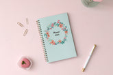 January 2024 to December 2024 weekly monthly planner in 5x8 size from day designer for blue sky with mint background and floral pattern, and gold twin wire-o binding