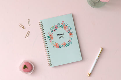 January 2024 to December 2024 weekly monthly planner in 5x8 size from day designer for blue sky with mint background and floral pattern, and gold twin wire-o binding