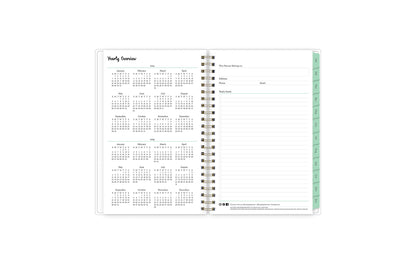 5x8 2024 weekly monthly planner features a yearly overview of 2023 and 2023 with contact page for owner of planner and bulleted yearly goals and accomplishments with mint monthly tabs