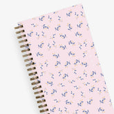 this one tree planted partnership planner for 2024 featuring a floral front cover with pink background and gold twin wire o binding in 3.625x6.125 pocket planner size.