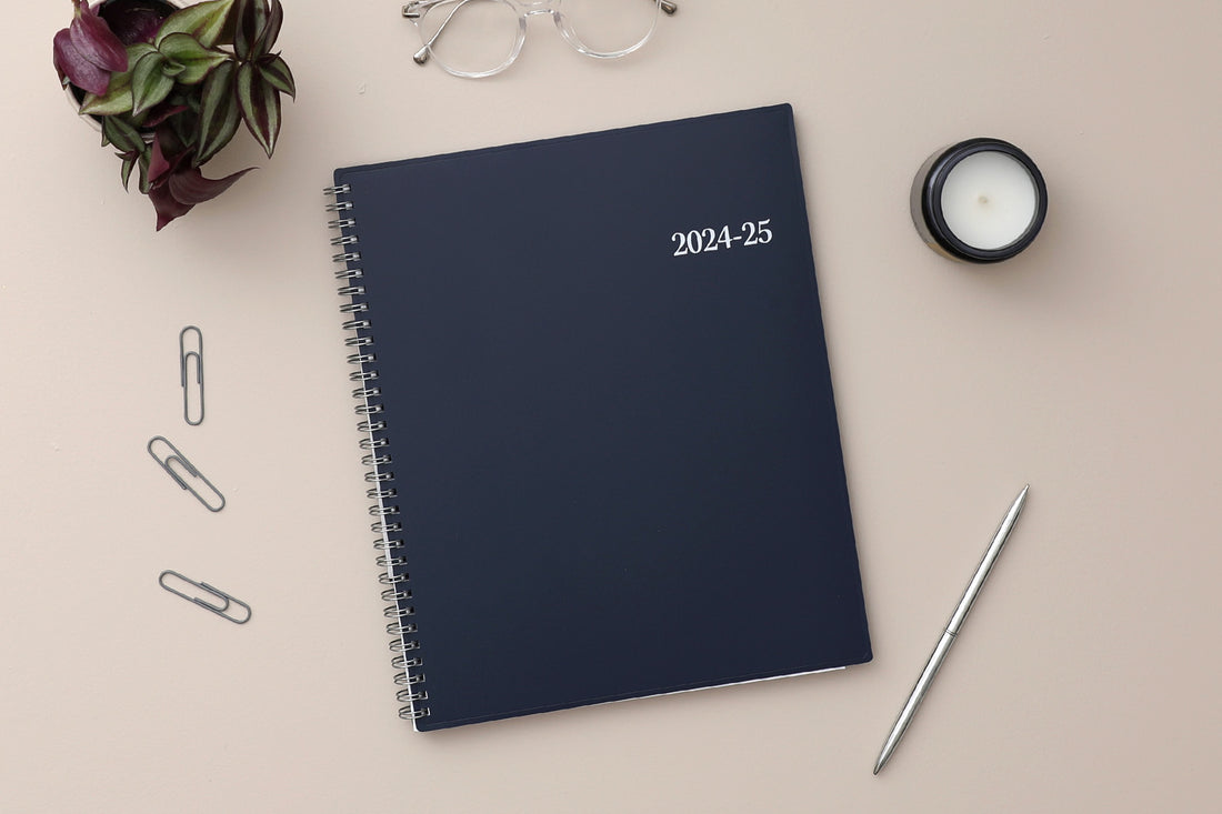 weekly monthly academic planner featuring a solid navy cover and silver twin wire-o binding 8.5x11 size for July 2024- June 2025