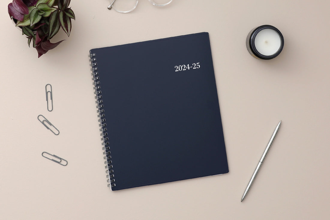 academic planner featuring a solid navy cover and silver twin wire-o binding 8x10 size for July 2024- June 2025