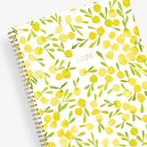 The kelly ventura 2026 weekly monthly planner for blue sky features beautiful lemons cover with gold twin wire-o binding in a 8.5x11 planner size.