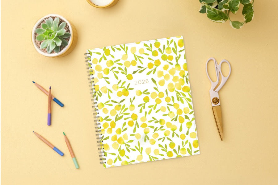 The kelly ventura 2026 weekly monthly planner for blue sky features beautiful lemons cover with gold twin wire-o binding in a 8.5x11 planner size.