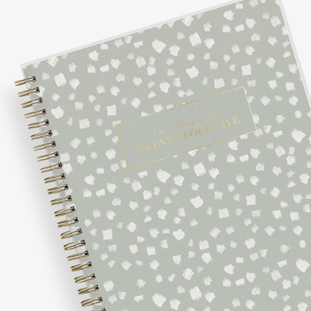 white blotches on soft neutral olive green back cover in 7x9 planner size weekly monthly planner