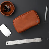 tan faux leather tech organizer, multiple pockets, mesh and elastic holders