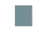 green blue back cover on this 7x9 planner with pink binding.
