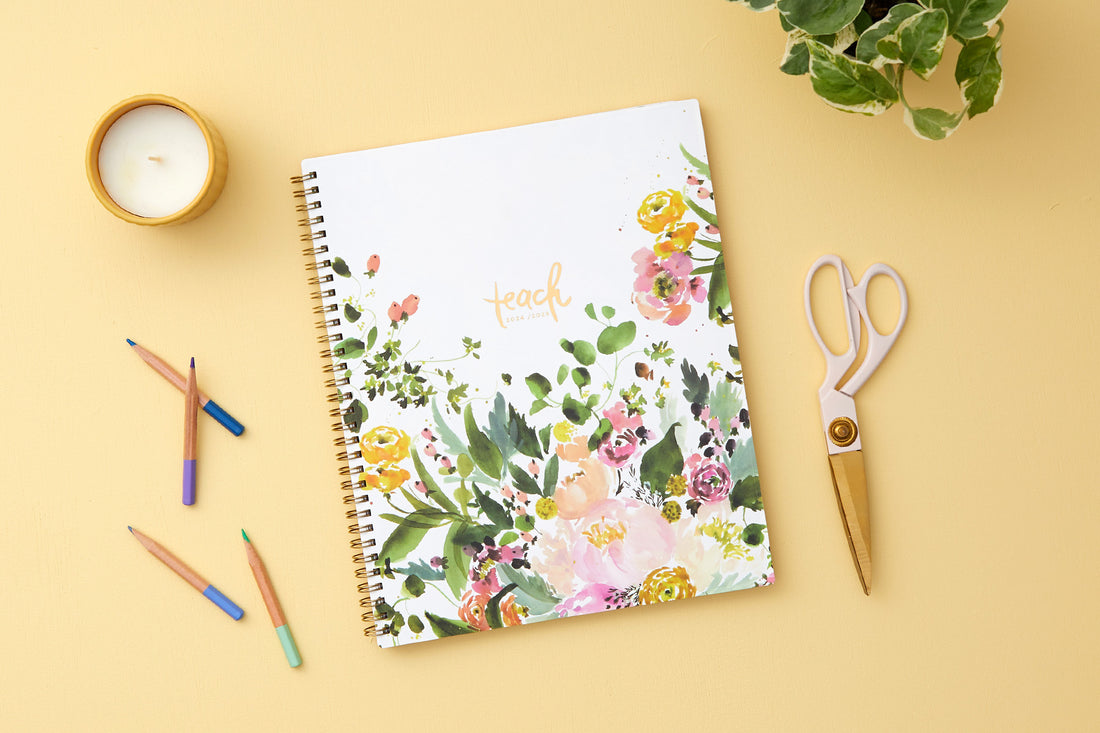 academic teacher lesson planner with weekly and monthly layouts featuring a multi colored floral front cover in 8.5x11 planner size for July 2024- June 2025