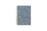 gold marble and cloudy blue background cover on this 2025 planner