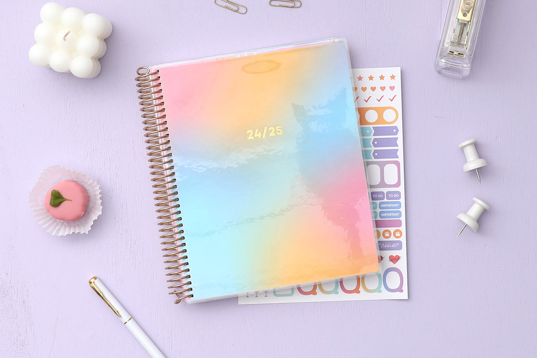 ombre rainbow 7x9 weekly monthly planner with gold wiire-binding on this July 2024-2025 academic planner featuring sticker sheet
