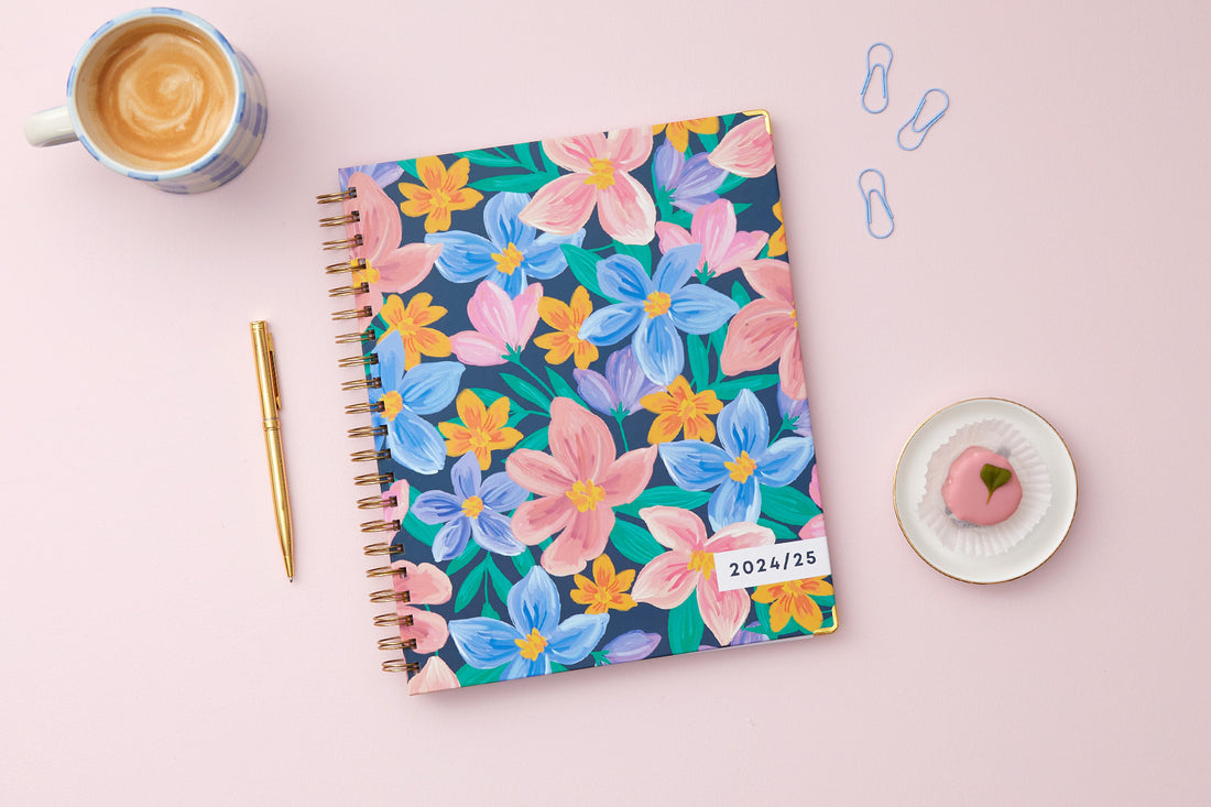 cheerful floral pattern on 8.5x11 planner size for this weekly monthly planner dated for July 2024- June 2025