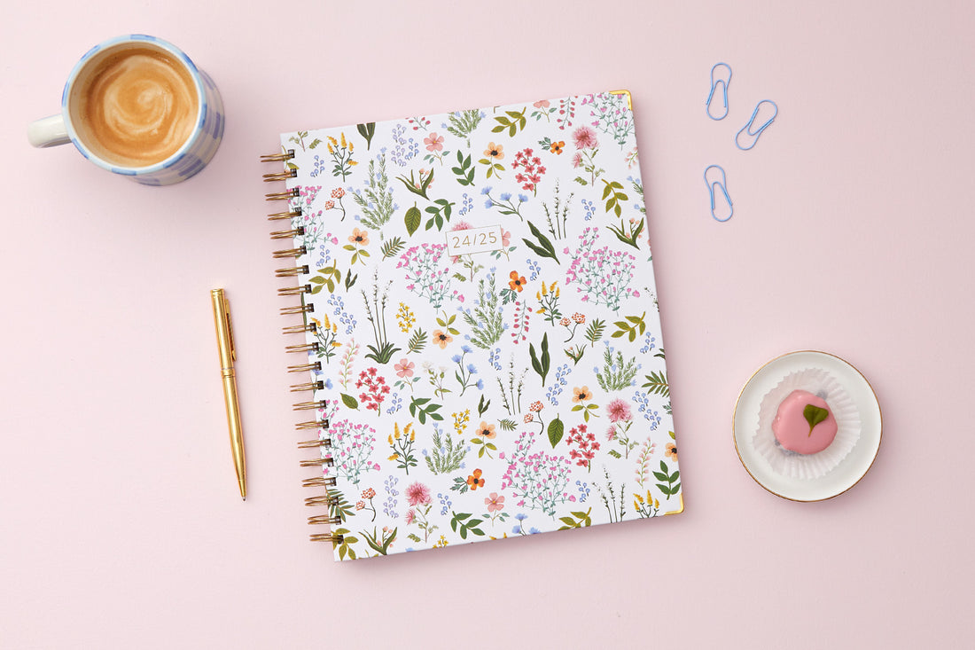 soft white background with floral pattern on this 8.5x11 weekly monthly planner for July 2024 - June 2025