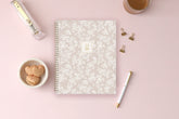 white floral printed front cover on a blush background for this 2025-2026 academic weekly monthly planner
