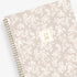 white floral printed front cover on a blush background for this 2025-2026 academic weekly monthly planner