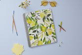 The kelly ventura 2025-2026 weekly monthly planner for blue sky features beautiful lemons cover with gold twin wire-o binding in a 8.5x11 planner size.