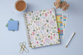 soft white background with floral pattern on this 8.5x11 weekly monthly planner for July 2025 - June 2026