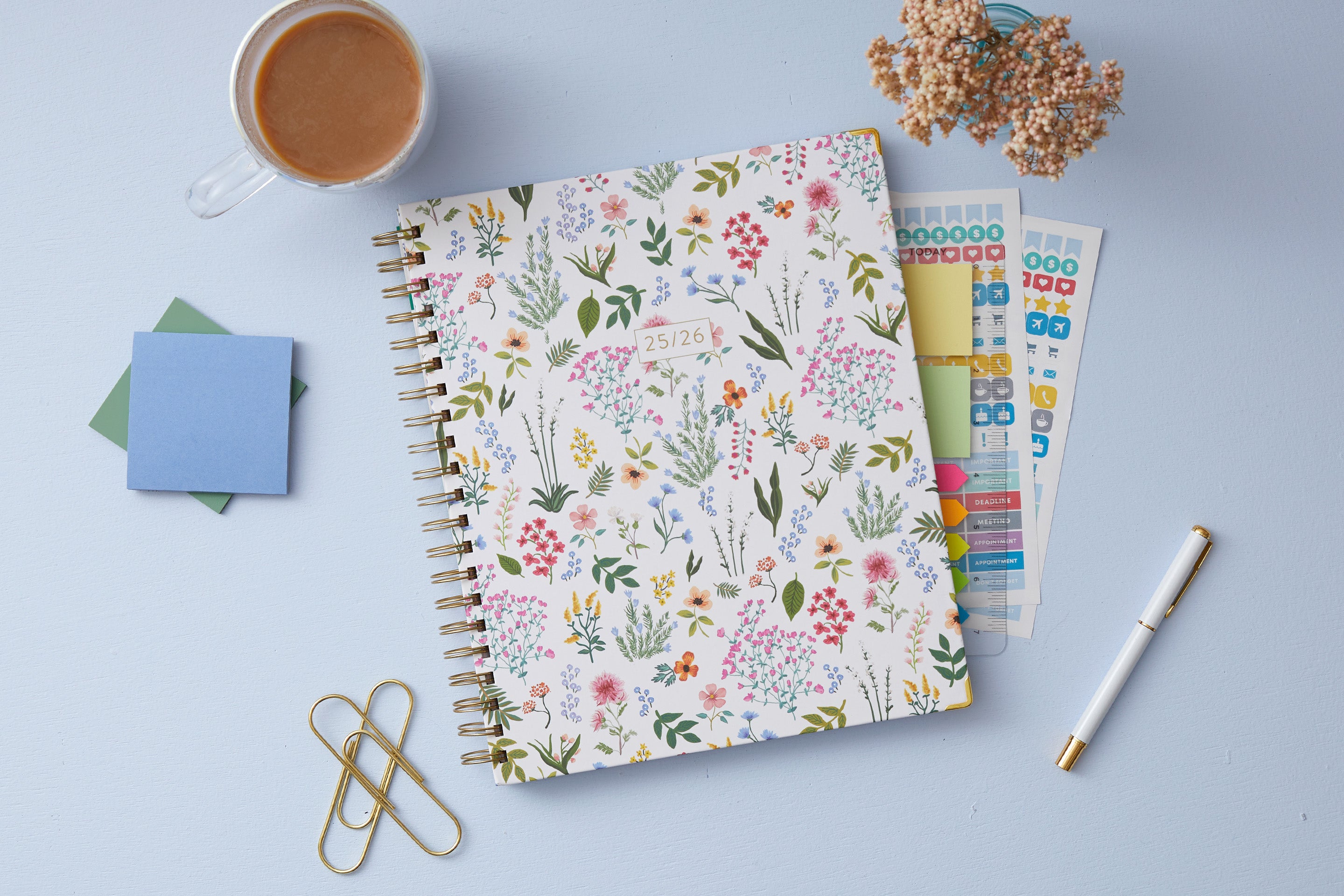 soft white background with floral pattern on this 8.5x11 weekly monthly planner for July 2025 - June 2026