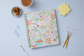  academic teacher lesson planner with weekly and monthly layouts featuring a multi colored floral front cover in 8.5x11 planner size
