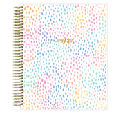 Spiral-bound weekly planner with a colorful dot pattern and &