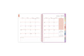 july 2025 - june 2026 weekly planner featuring a monthly spread with lined writing space, bullet points, and to dos. Multi colored monthly tabs, top goals