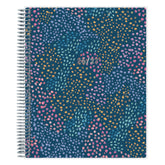 Spiral-bound planner with a colorful dot pattern on a blue background