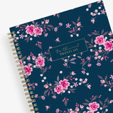 Floral 2026 planner with a blue background and pink flowers on a white background