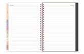 Spiral-bound planner with lined pages and color-coded tabs on a white background