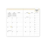 2026 monthly pocket planner featuring monthly spread with reference calendars, lined writing space