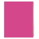 Pink weekly planner with a spiral binding on a white background