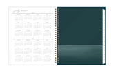 Teal planner with calendar pages on a white background, clear paper pocket
