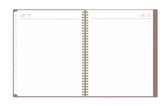 Open notebook with lined pages on a white background