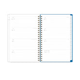 Spiral-bound planner with a to-do list on a table with lemons, a pen, and sunglasses, lined writing space and white monthly tabs