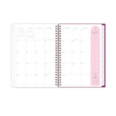 monthly spread featuring blank writing space, pink note taking section, and white monthly tabs