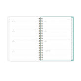 Open planner with to-do list on a sandy surface with sunglasses and shells, lined writing space and white monthly tabs
