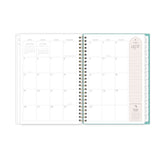 monthly spread featuring blank writing space, pink note taking section, and white monthly tabs