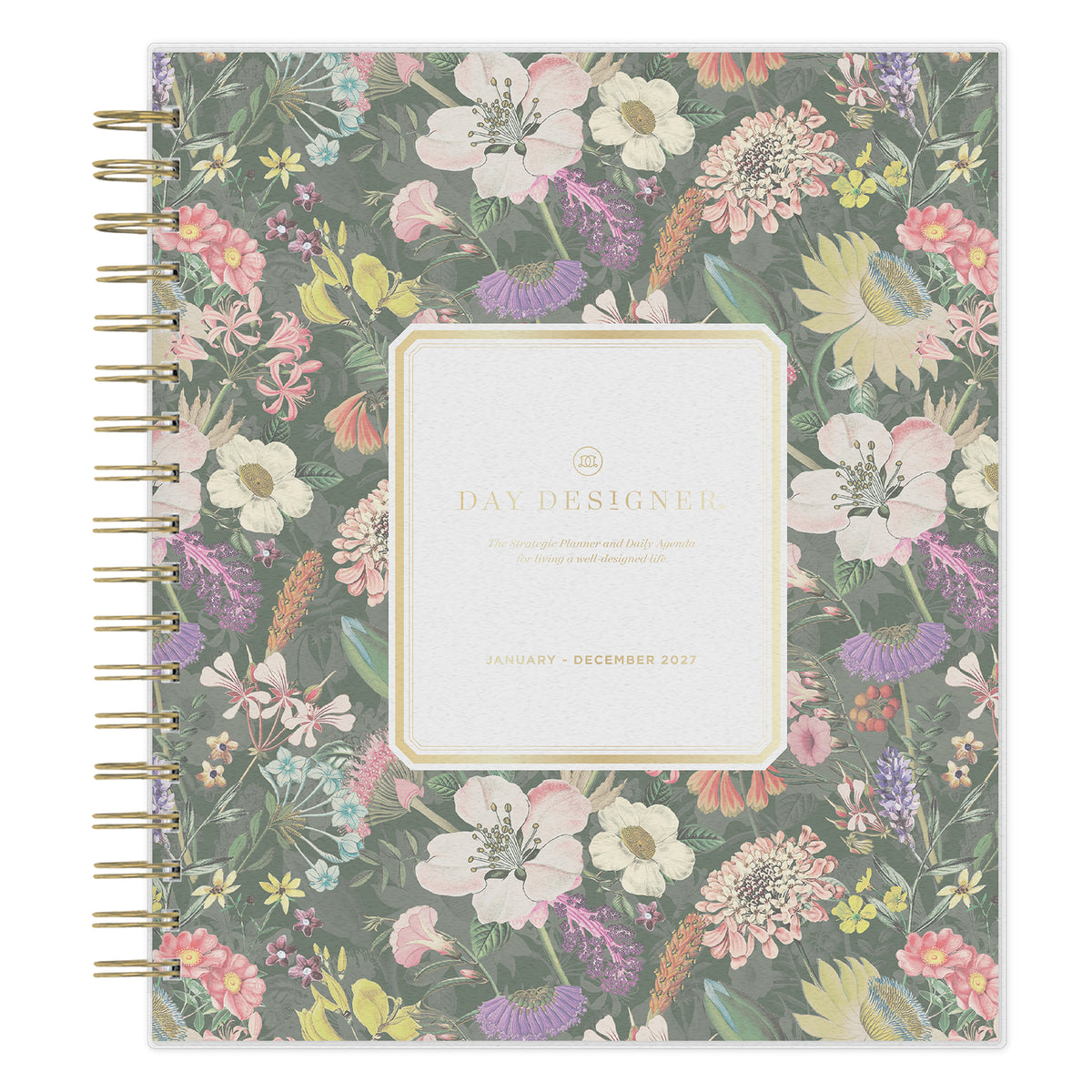 A Day Designed 2027 planner with a floral pattern cover, featuring a central cream-colored label and gold spiral binding on the left side.