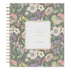 A Day Designed 2027 planner with a floral pattern cover, featuring a central cream-colored label and gold spiral binding on the left side.