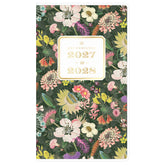 A floral planner calendar cover for 2027 to 2028, featuring a dense multicolor flower pattern on a dark green background with a cream-colored central label. pocket sized monthly planner