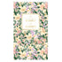 A tall daily planner with a watercolor floral cover pattern in green, pink, and cream, featuring a gold-bordered label in the center that reads &